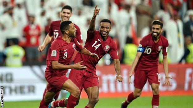 Qatar players celebrate a goal