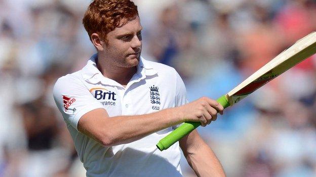 Jonny Bairstow raises his bat for England