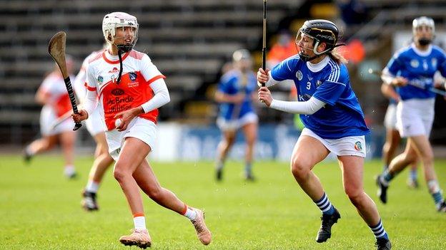 Armagh's Rachael Merry tries to get in a shot despite the efforts of Cavan's Lorna Cahill