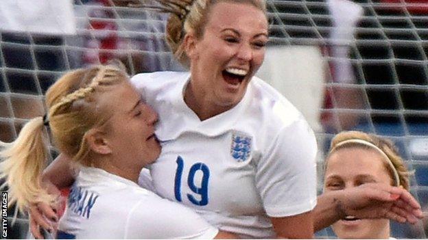 Toni Duggan celebrates scoring England's opening goal against Germany