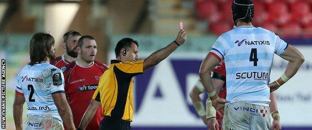 Referee Greg Garner shows a red card to Racing's Bernard Le Roux