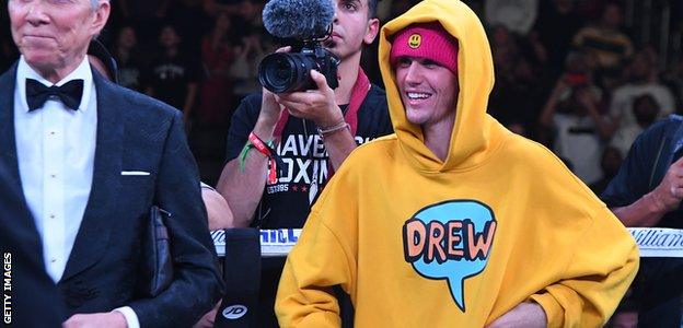 Justin Bieber stands in the ring