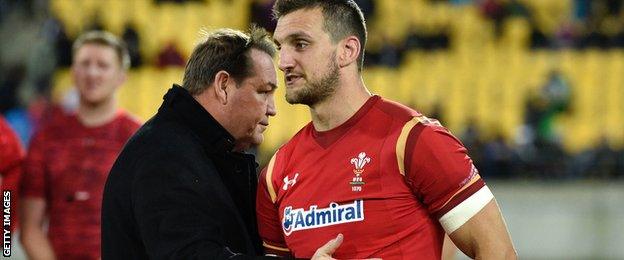 New Zealand head coach Steve Hansen (L) talks with Wales captain Sam Warburton (R) after the game in Wellington