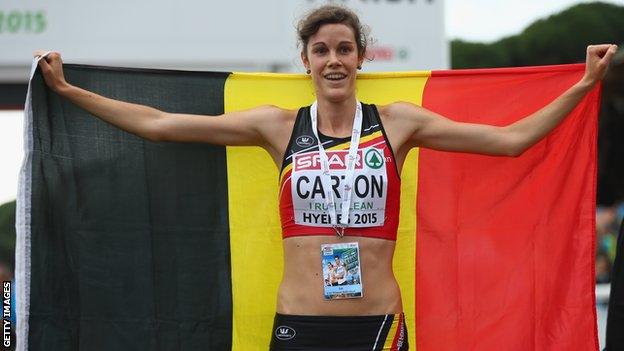 Belgium's Louise Carton celebrates after her European Under-23 Cross Country triumph in Hyeres on Sunday