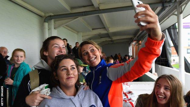 England captain Charlotte Edwards takes a "selfie" picture with fans