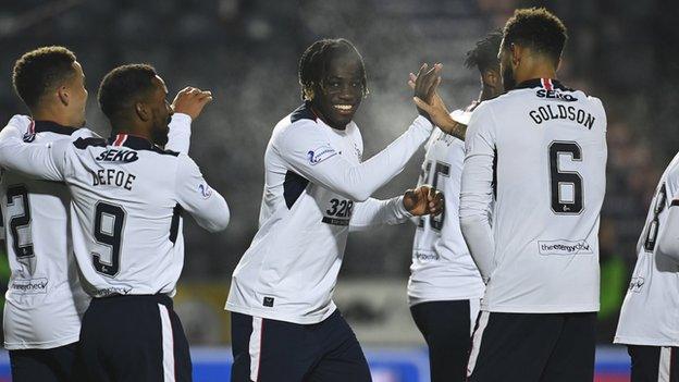 Calvin Bassey celebrates with Connor Goldson