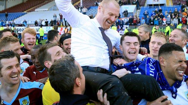 Sean Dyche and Burnley players celebrate promotion