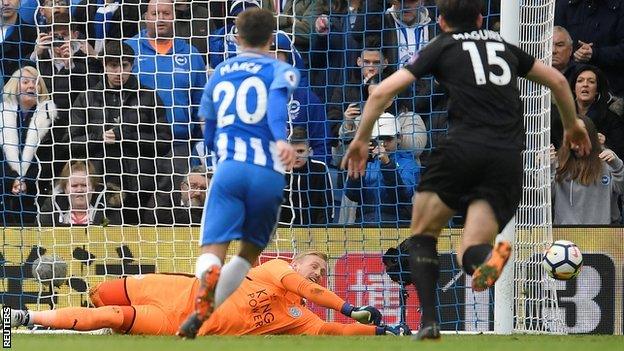 Kasper Schmeichel saves Glenn Murray's penalty.