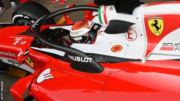 Ferrari's Kimi Raikkonen tests the new halo head protection system