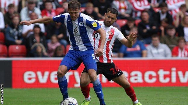 Wigan's Charlie Wyke in action against former club Sunderland.