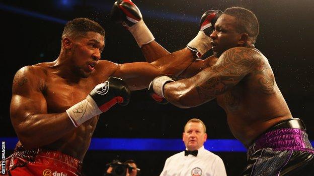 Anthony Joshua lands a right hand on Dillian Whyte