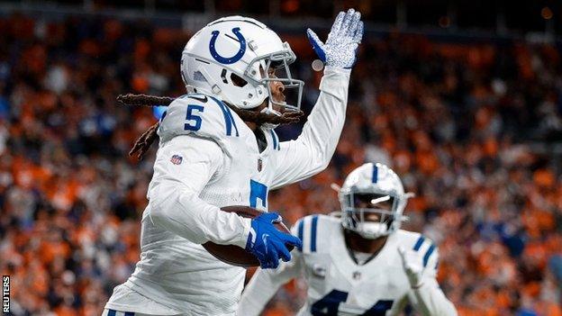 Stephon Gilmore celebrates an interception