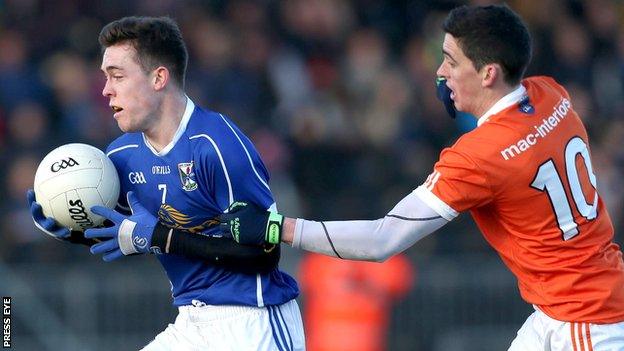 Cavan's Dara McVeety tries to burst away from Armagh's Rory Grugan at Crossmaglen