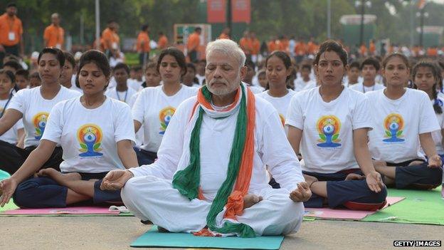 Indian Prime Minister Narendra Modi participates in a mass yoga session to mark the International Yoga Day in New Delhi on 21 June 2015.