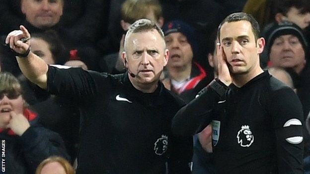 Referee Jon Moss (left) and assistant Eddie Smart