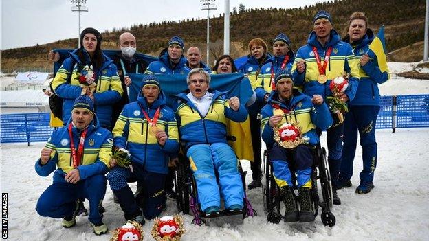 The Ukraine team and officials after their relay success