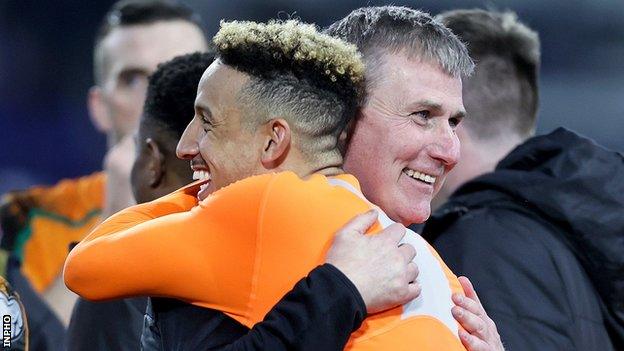 Republic of Ireland manager Stephen Kenny embraces striker Callum Robinson after the team's 3-0 win in Luxembourg