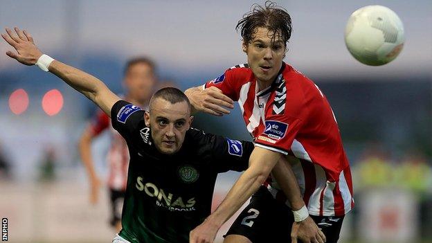 Dylan Connolly battles with Derry's Niclas Vemmelund at the Carlisle Grounds