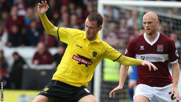 Tom Naylor (left) in action for Burton Albion against Northampton Town last season