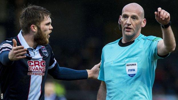 Ross County's Martin Woods remonstrates with referee Bobby Madden