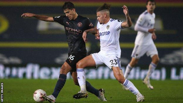 Rodri and Kalvin Phillips compete for the ball at Elland Road in October 2020