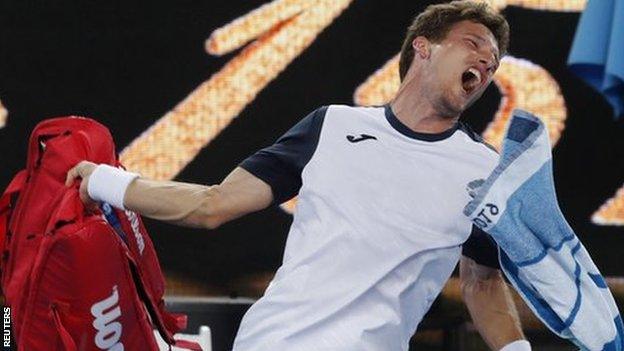 Pablo Carreno Busta throws his kit bag after losing to Kei Nishikori