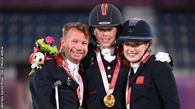 Lee Pearson, Sophie Wells and Natasha Baker celebrate team gold