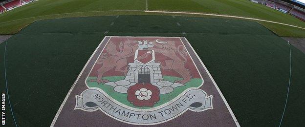 Northampton Town badge next to pitch