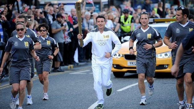 Lord Coe with Olympic torch