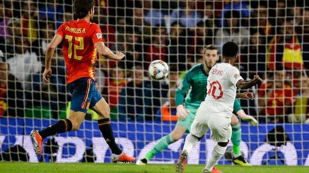 Raheem Sterling scores the opening goal for England against Spain