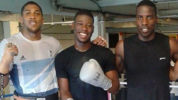 Anthony Joshua (left) shared an old image of him with Chamberlain and Okolie on Twitter, writing: These two fighters have come a LONG way! Respect to them for putting everything on the line... Expect fireworks come Saturday night