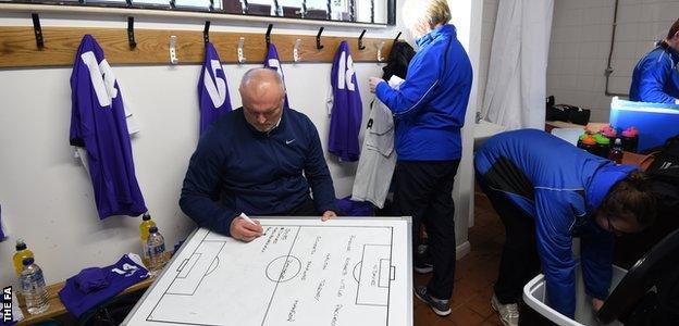 Neil Redfearn gets his tactics written down in the changing room before taking charge of WSL 2 side Doncaster Rovers Belles out for the first time