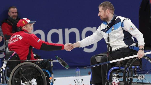 Scotland's Hugh Nibloe (right) shakes hands with a member of the Russian team