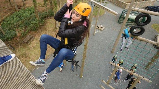 Caitlin on the rope climbing