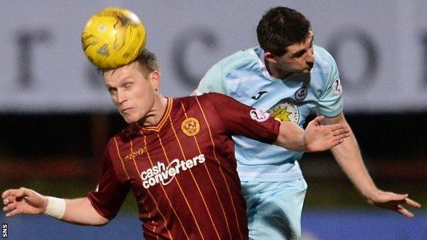 Motherwell's Steven Hammell challenges Partick Thistle's Kris Doolan