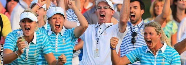 European Team members Anna Nordqvist of Sweden, Catriona Matthew of Scotland, Graeme Matthew of Scotland and Suzann Pettersen of Norway celebrate as Carlota Ciganda of Spain and the European Team makes a birdie putt on the 18th hole to win the match