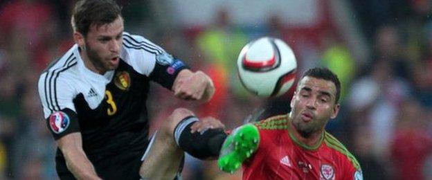 Hal Robson-Kanu of Wales challenges Nicolas Lombaerts of Belgium