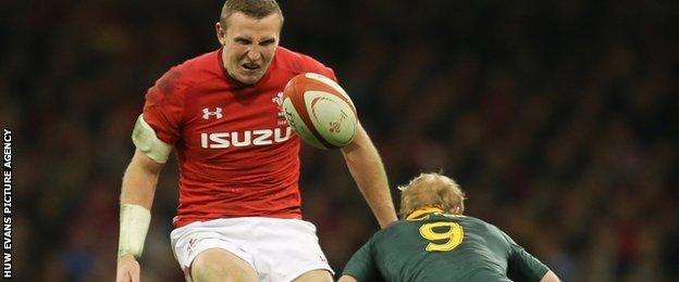 Hadleigh Parkes kicks the ball over South Africa's Ross Cronje