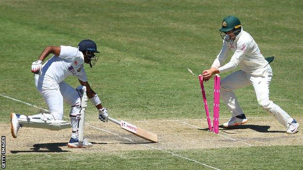 India batsman Ravichandran Ashwin (left) is run out by Australia's Marnus Labuschagne (right) during the third Test