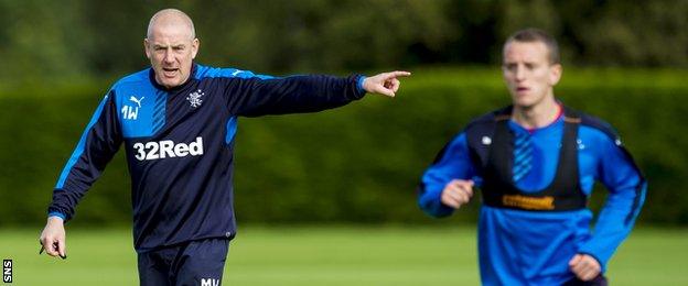 Rangers manager Mark Warburton instructs his players in training