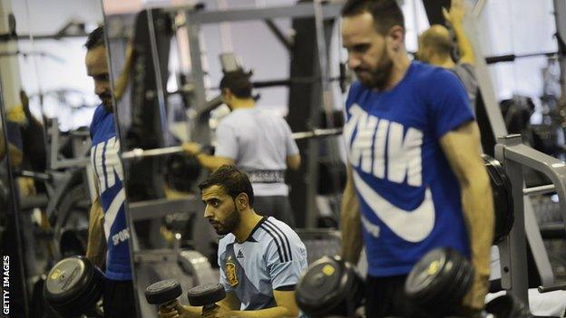 Men exercising in a gym