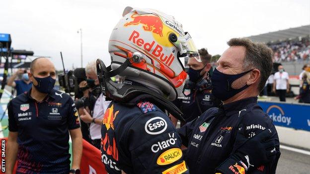 Max Verstappen celebrates his win with team principle Christian Horner