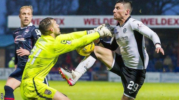 Ross County goalkeeper Martin Woods challenges St Johnstone's Michael O'Halloran