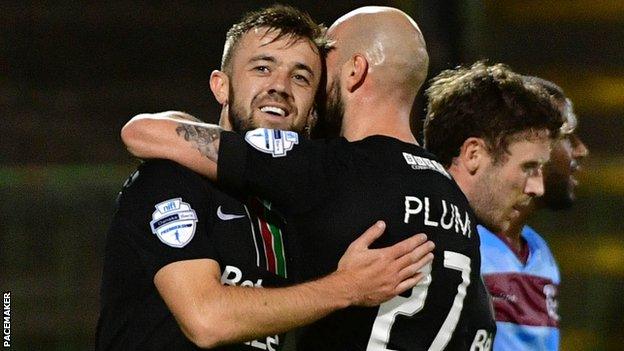 Glentoran scorer Conor McMenamin is congratulated by Hrvoje Plum