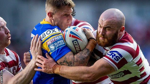 Liam Sutcliffe is tackled by Jake Bibby