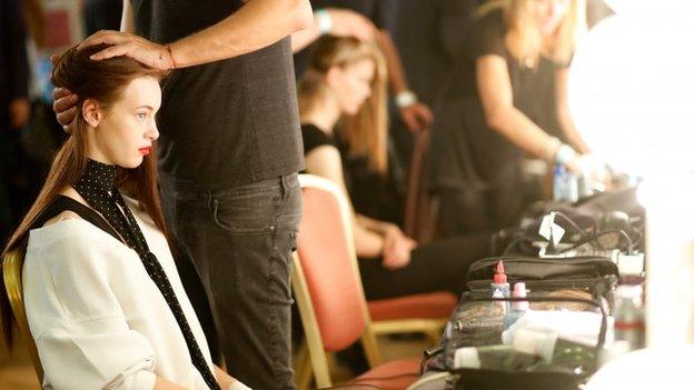 A model backstage ahead of the Felder Felder show during London Fashion Week Spring/Summer 2016