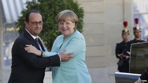 President Francois Hollande embraces Chancellor Angel Merkel