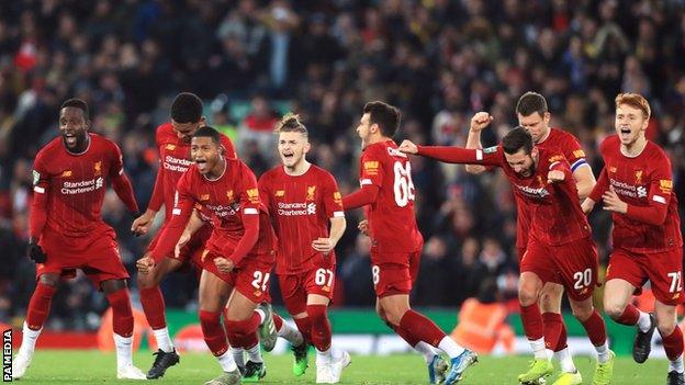 Liverpool celebrate beating Arsenal 5-4 on penalties after a 5-5 draw in the League Cup