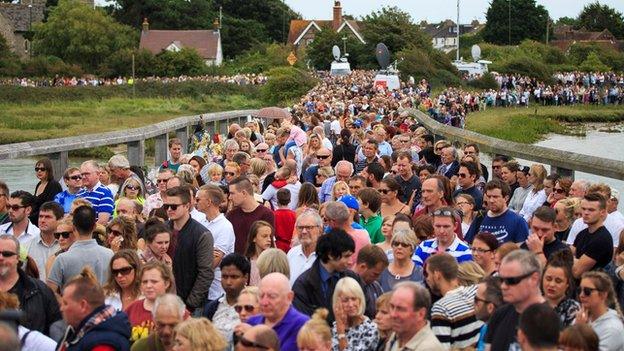 Mourners on a bridge in Shoreham during the minutes silence