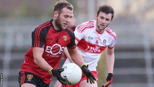 Down's Darren O'Hagan in action against Derry's Patrick Kearney at Pairc Esler